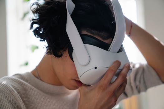 Close-up of a young adult using a VR headset indoors.