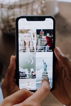 Close-up of a person using a smartphone to browse a social media app indoors.