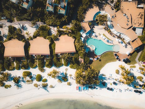 Explore a luxury tropical resort in Playa del Carmen with stunning views of the beach and swimming pool.